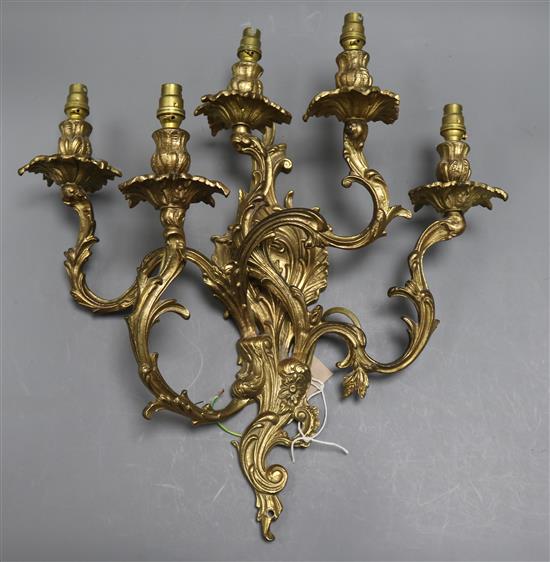 A brass five branch candelabra wall light